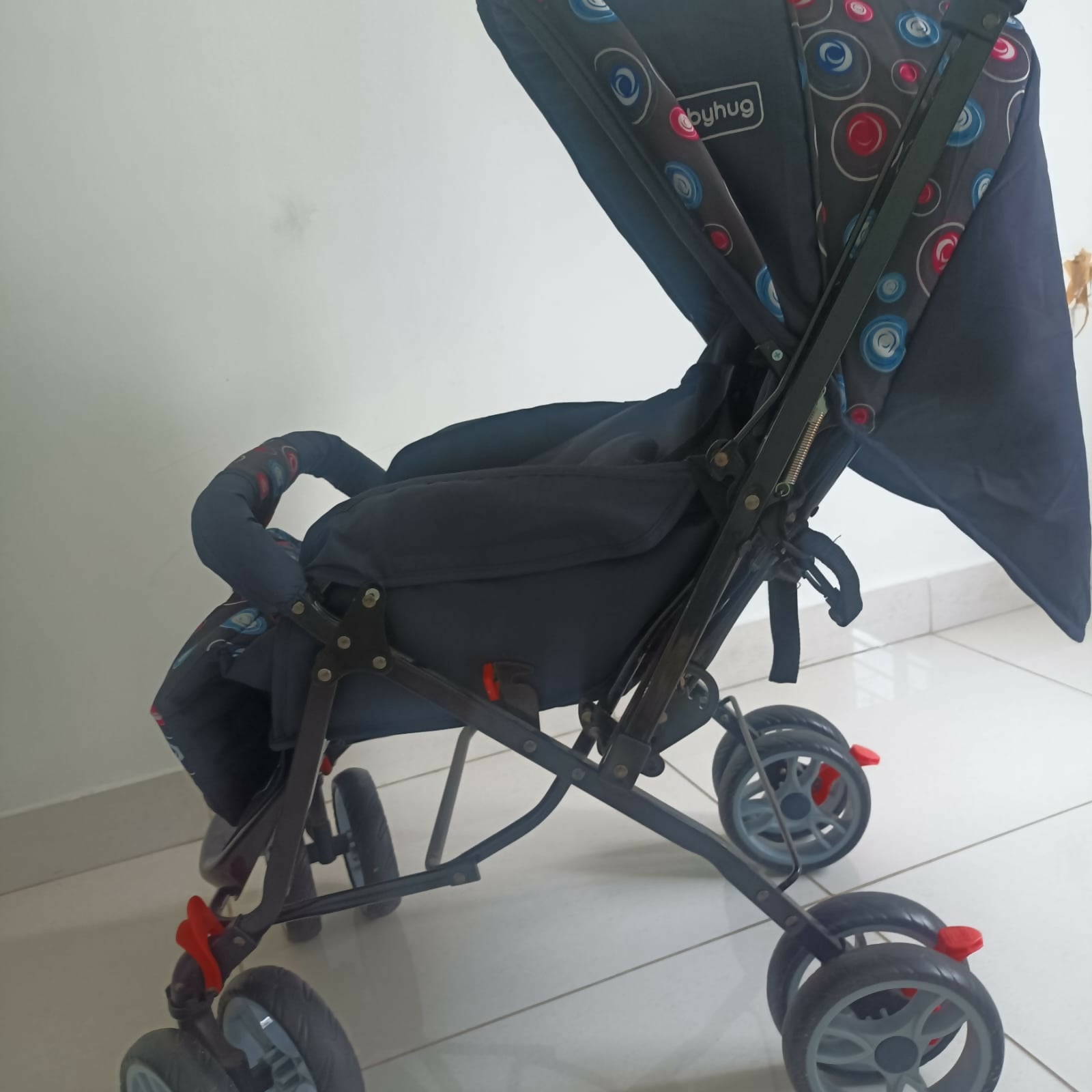 BABYHUG Comfy Ride stroller in dark blue with reclining seat, foldable design, safety harness, adjustable canopy, smooth wheels, and comfortable travel support for babies and toddlers.