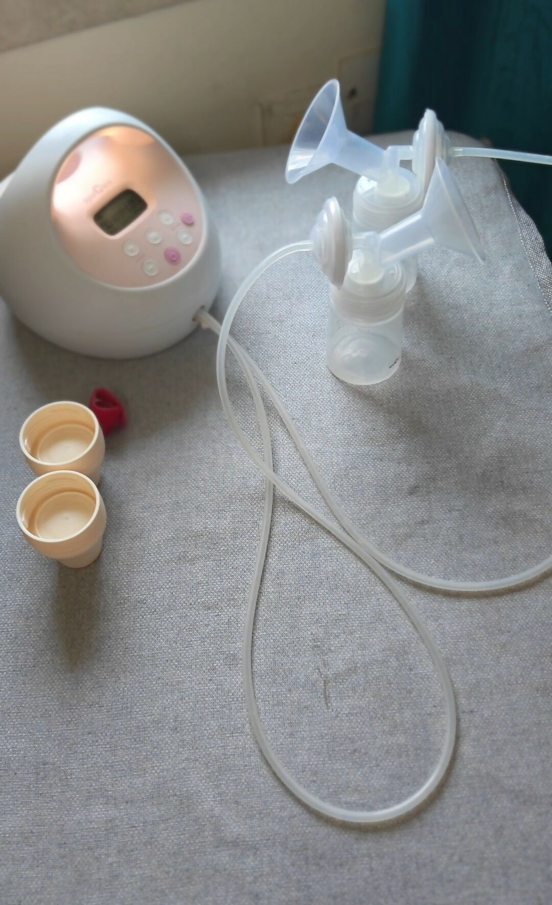 SPECTRA S2 Plus hospital-grade double electric breast pump with dual pumping system, adjustable suction settings, milk collection bottles, and comfortable breastfeeding support for nursing mothers.