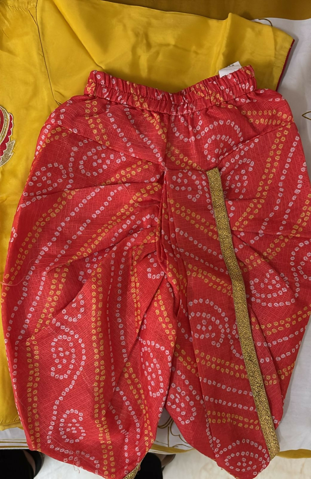 Red patterned fabric with a yellow background