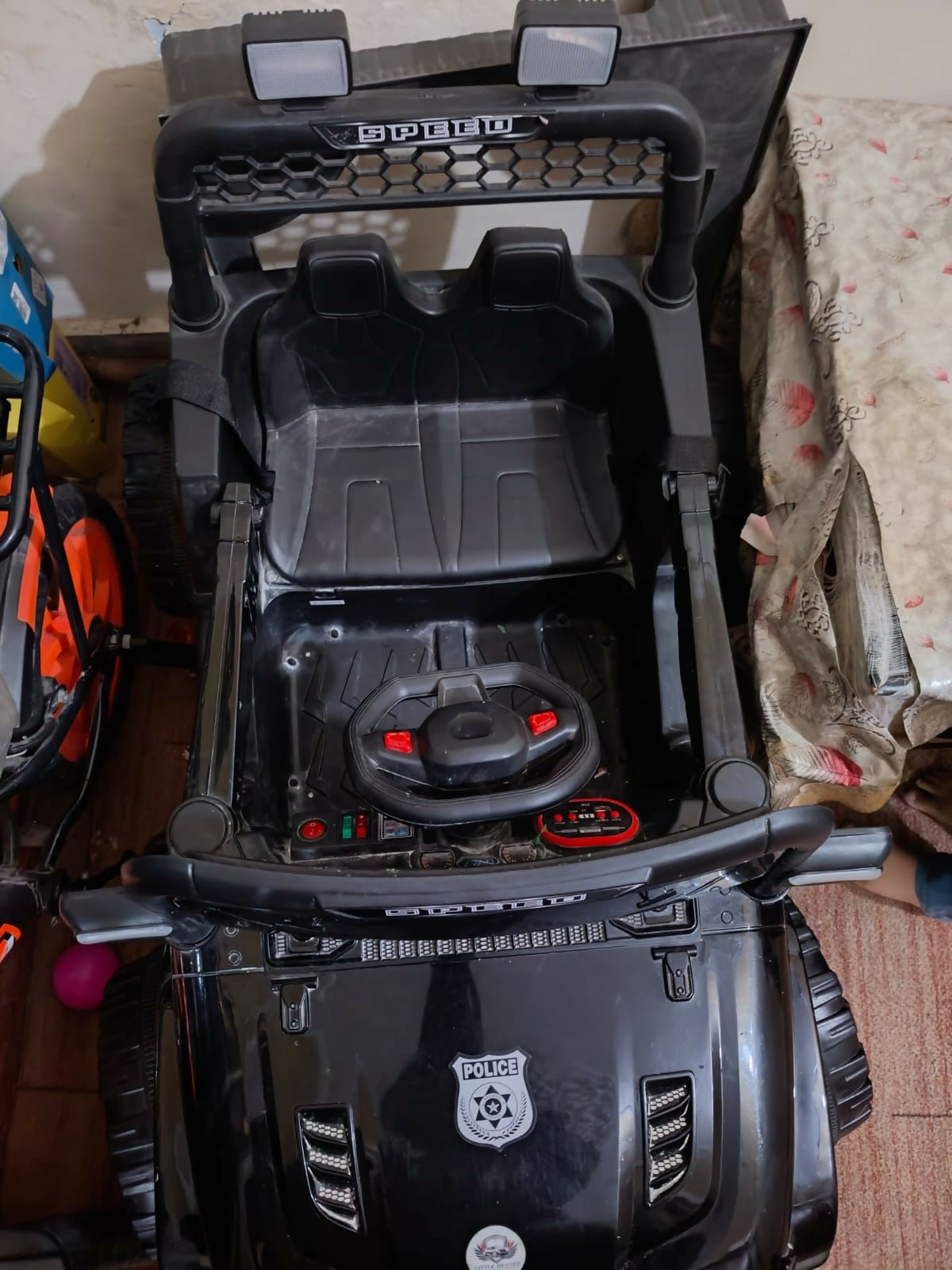 Electric car for kids with a rechargeable battery, realistic steering wheel, comfortable seat, LED lights, durable wheels, and easy controls for fun indoor and outdoor adventures.
