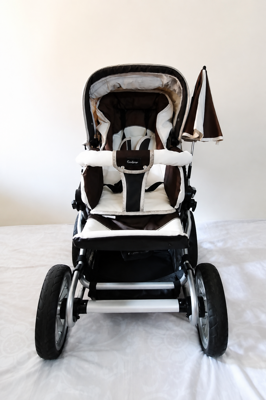 Emmaljunga City Cross Premium Stroller B128 in Almost New condition, available in Chennai, Tamil Nadu, featuring a reversible seat, comfortable reclining design, protective canopy, rain cover, sturdy frame, and smooth wheels.