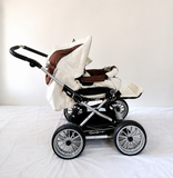 Emmaljunga City Cross Premium Stroller B128 in Almost New condition, available in Chennai, Tamil Nadu, featuring a reversible seat, comfortable reclining design, protective canopy, rain cover, sturdy frame, and smooth wheels.
