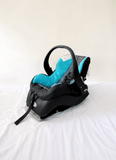 Evenflo Embrace infant car seat with base, rear-facing design, cushioned newborn support, secure safety harness, and portable baby carrier functionality for safe travel.
