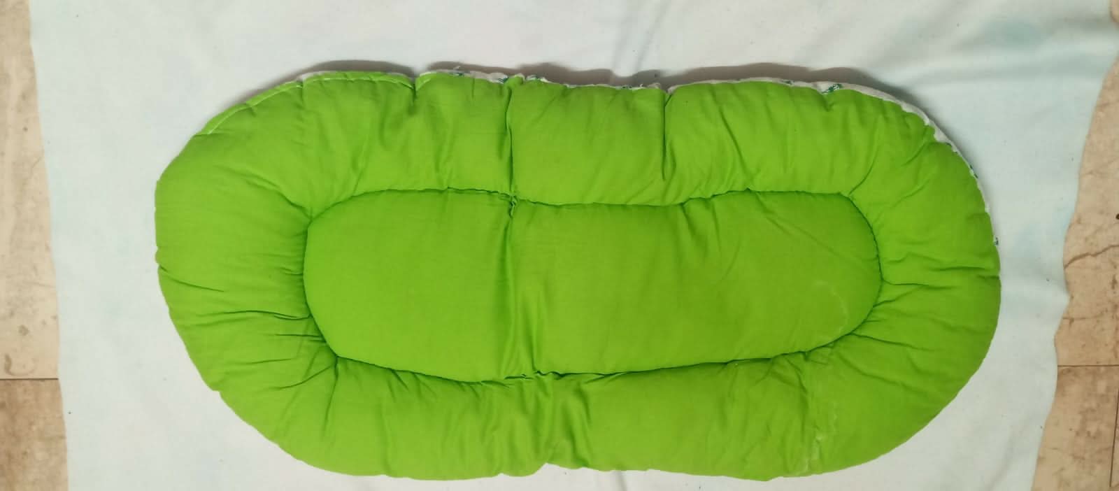 Soft and portable baby bed for newborns – perfect for home or travel.