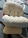 Frido maternity pillow with ergonomic full-body support, soft breathable fabric, and a comfortable design to support the back, belly, hips, and legs during pregnancy.