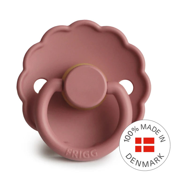 Pink pacifier with 'Frigg' branding and 'Made in Denmark' badge on a white background