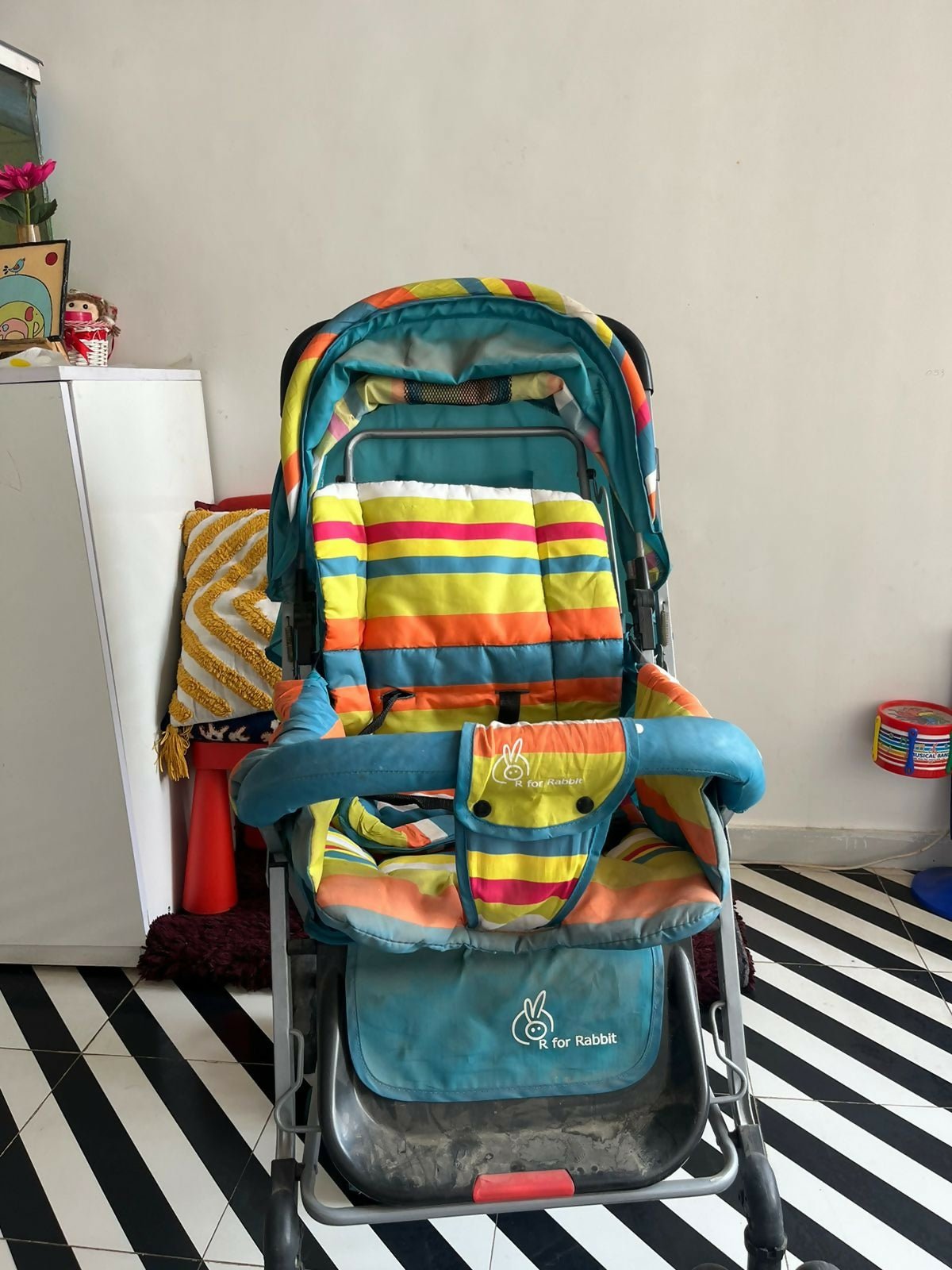 R for Rabbit Lollipop Lite baby stroller/pram with a lightweight foldable design, reclining seat, adjustable canopy, 5-point safety harness, smooth wheels, and storage basket for comfortable travel with babies and toddlers.