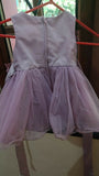 Light purple dress hanging on a rack