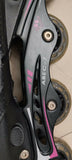 Close-up of a rollerblade with ABEC-7 bearings on a dark background