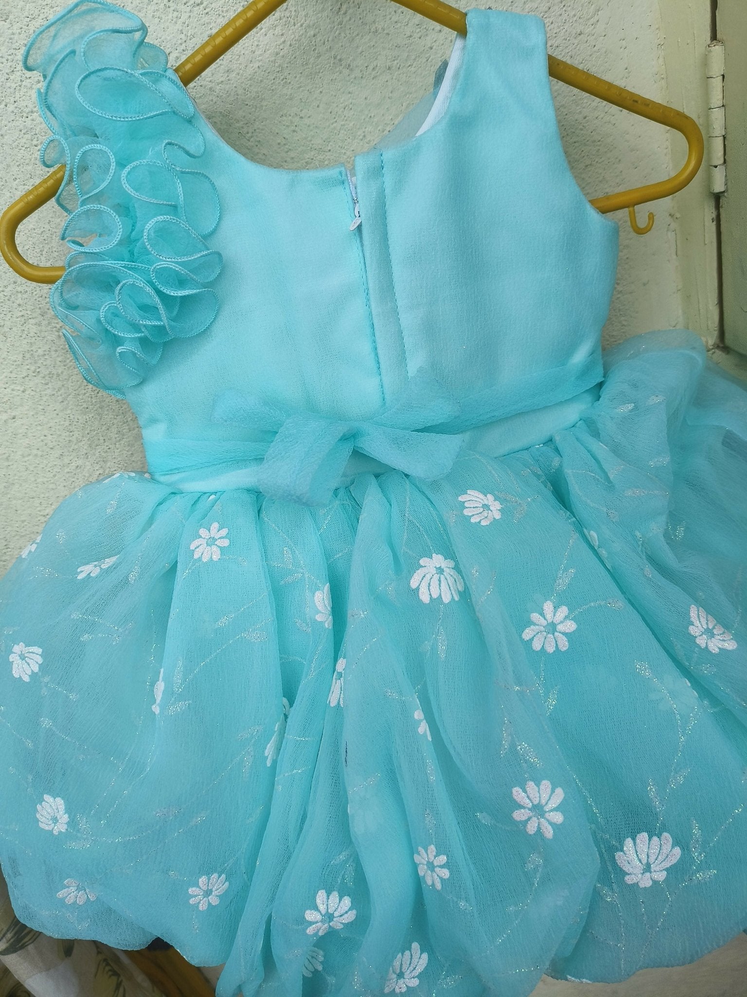 Light blue dress with floral patterns