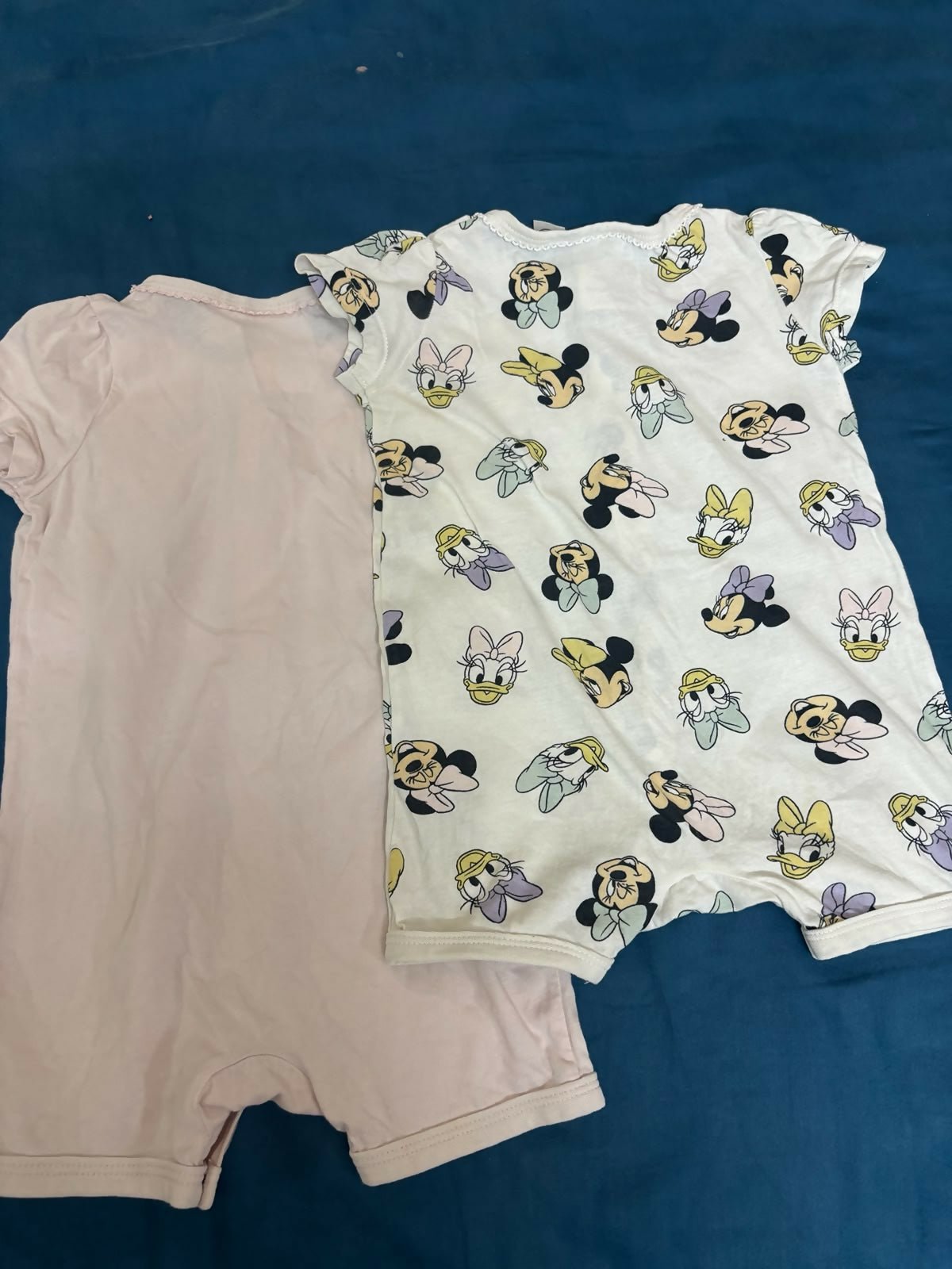 H&M Disney Collection 2-pack cotton rompers featuring soft breathable fabric, comfortable fit, easy wear design, and playful character-inspired prints for babies and toddlers.