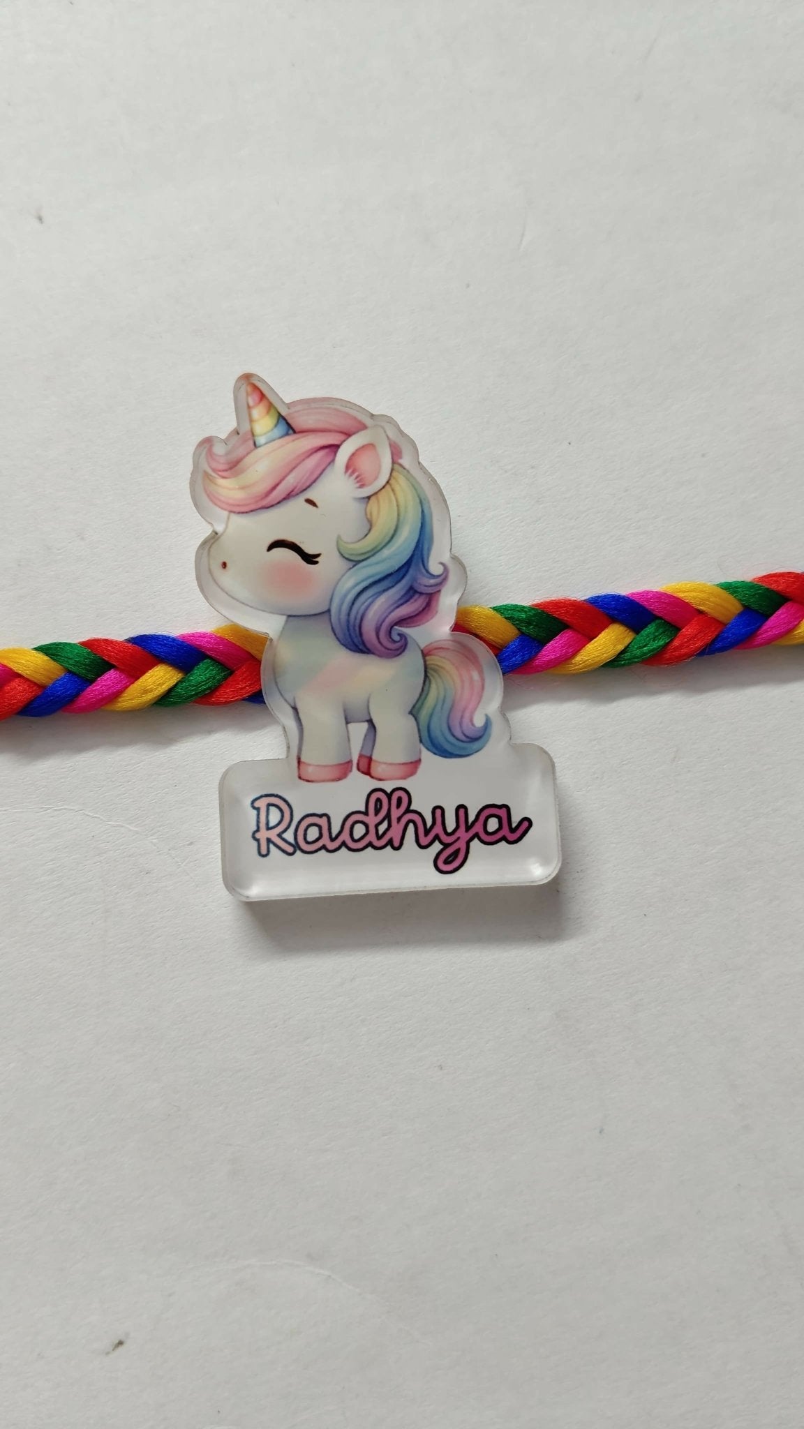 Personalized kids Rakhi featuring a custom name design, soft child-friendly materials, colorful embellishments, and a comfortable thread for celebrating Raksha Bandhan.