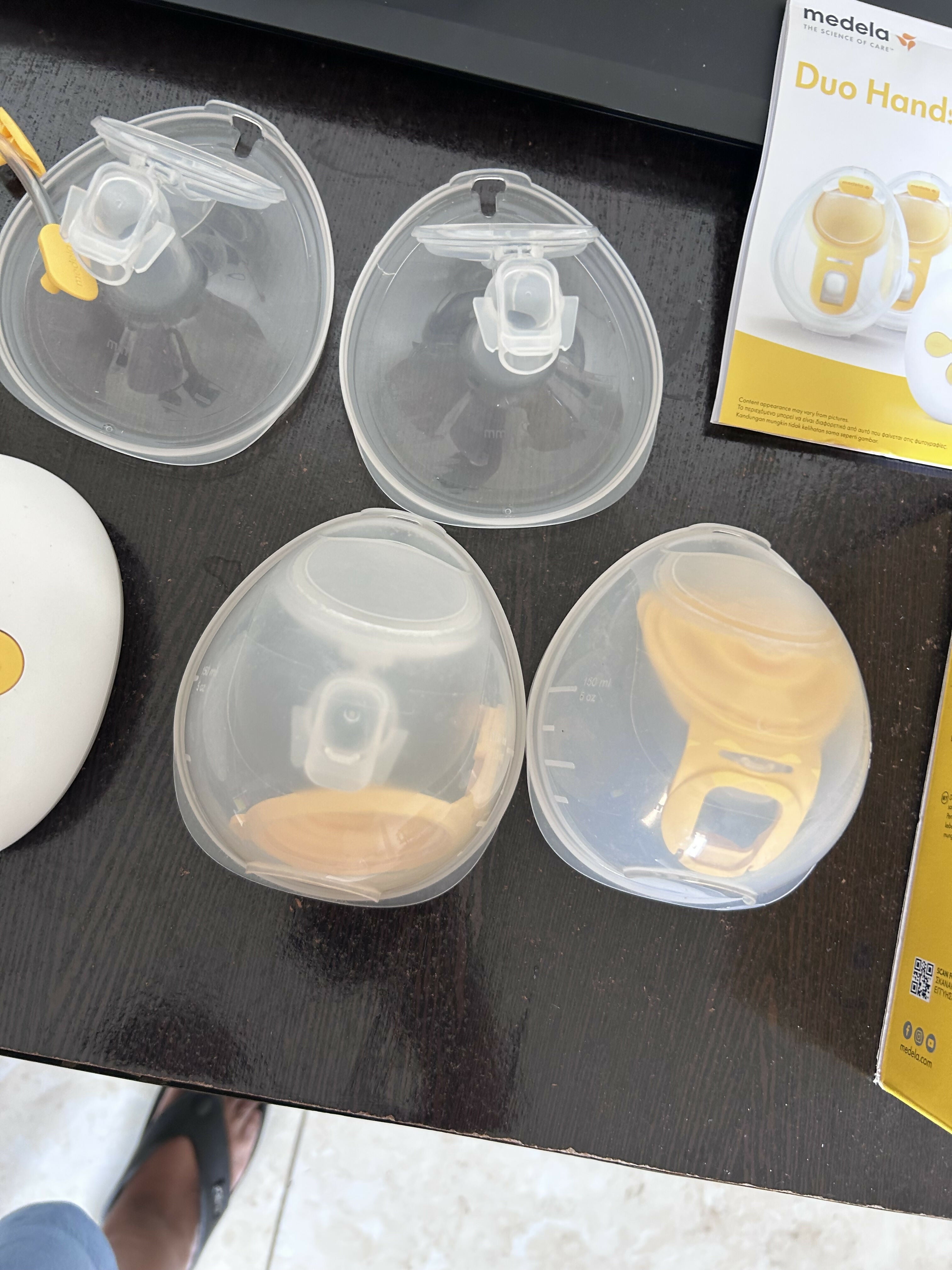 Medela Duo Wearable Electric Breast Pump with a hands-free in-bra design, adjustable suction levels, rechargeable battery, and soft breast shields for comfortable and efficient milk expression.