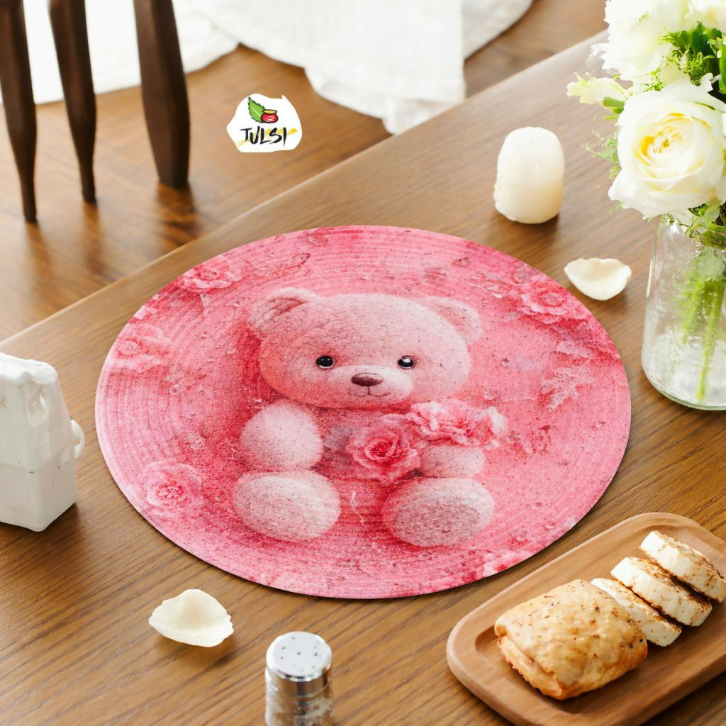 Round pink placemat with a teddy bear design