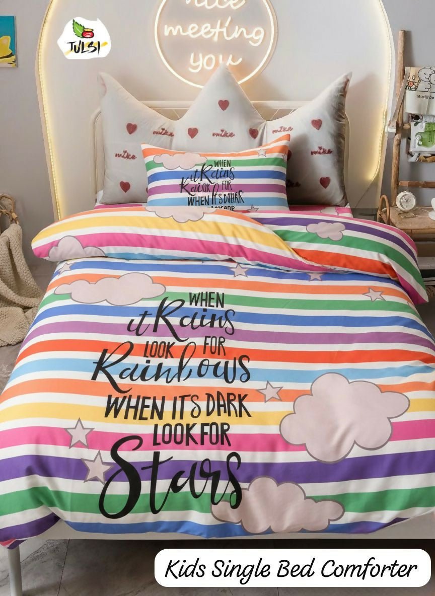 Colorful striped bed comforter with motivational quote on a bed