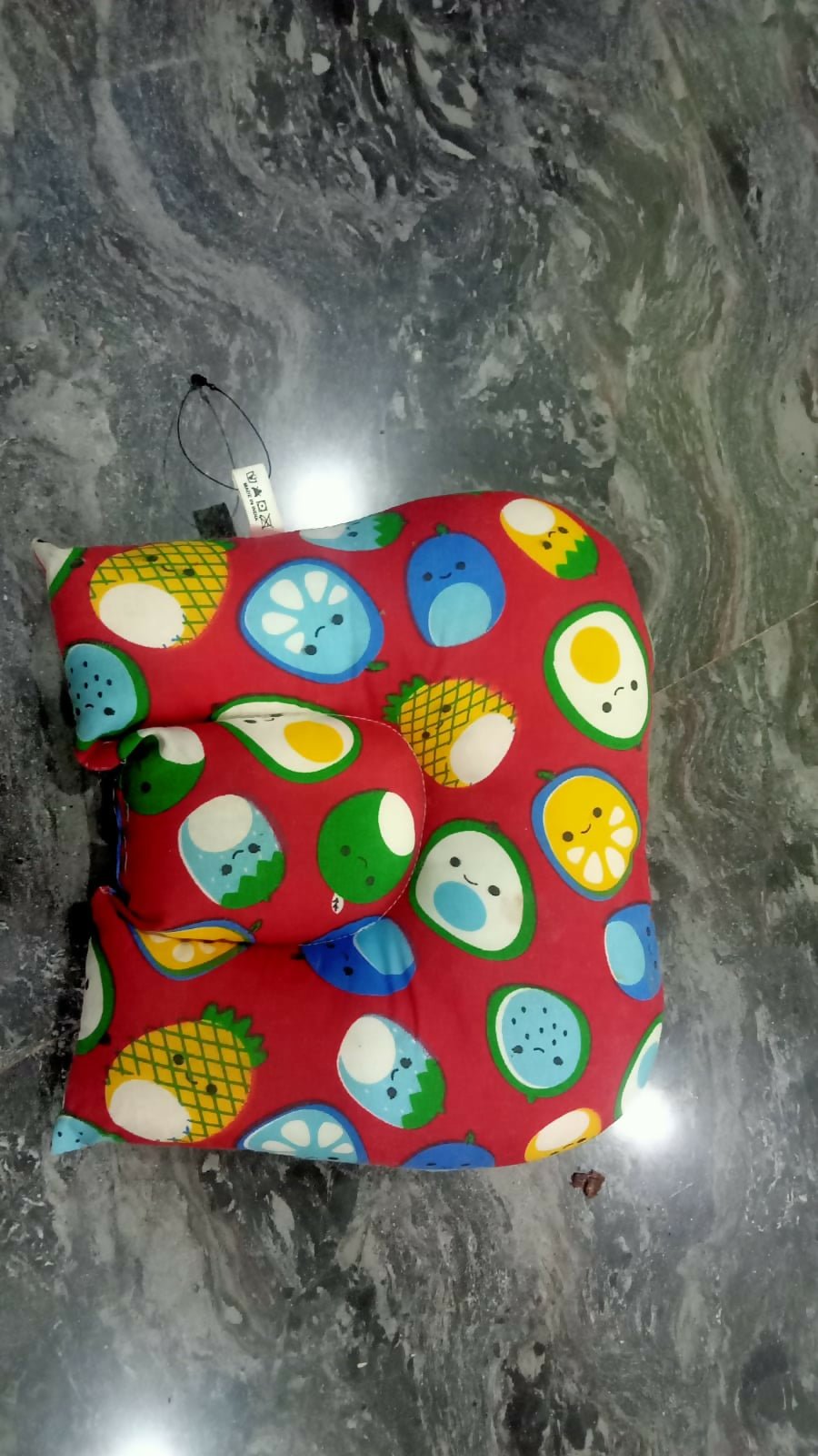 Colorful patterned bag on a marble surface