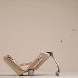 Beige suitcase with a handle on a beige background