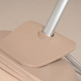 Beige suitcase with a handle on a beige background