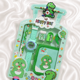 iLearnNGrow Luggage Packing Stationery Rakhi Combo in Green featuring school essentials, watch, wallet, stationery items, and a festive Rakhi, packed as a fun and practical Raksha Bandhan gift for kids.