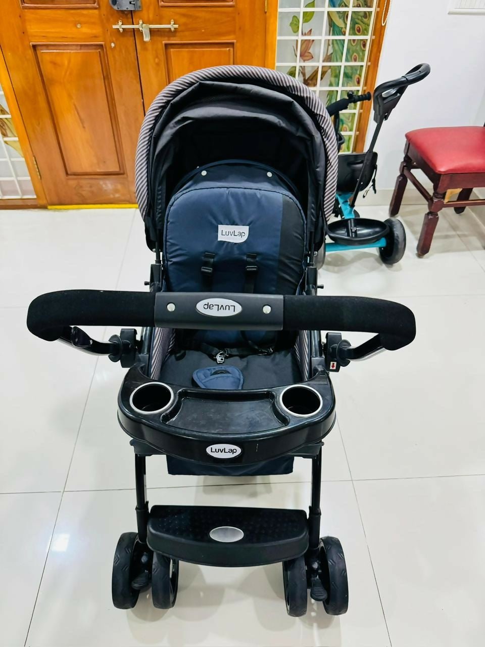LuvLap baby stroller with lightweight foldable design, reclining seat, adjustable canopy, 5-point safety harness, smooth wheels, and storage basket for comfortable travel with babies and toddlers.
