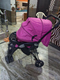 LUVLAP Galaxy stroller in pink with reclining seat, smooth wheels, safety harness, adjustable canopy, and comfortable travel design for babies and toddlers.
