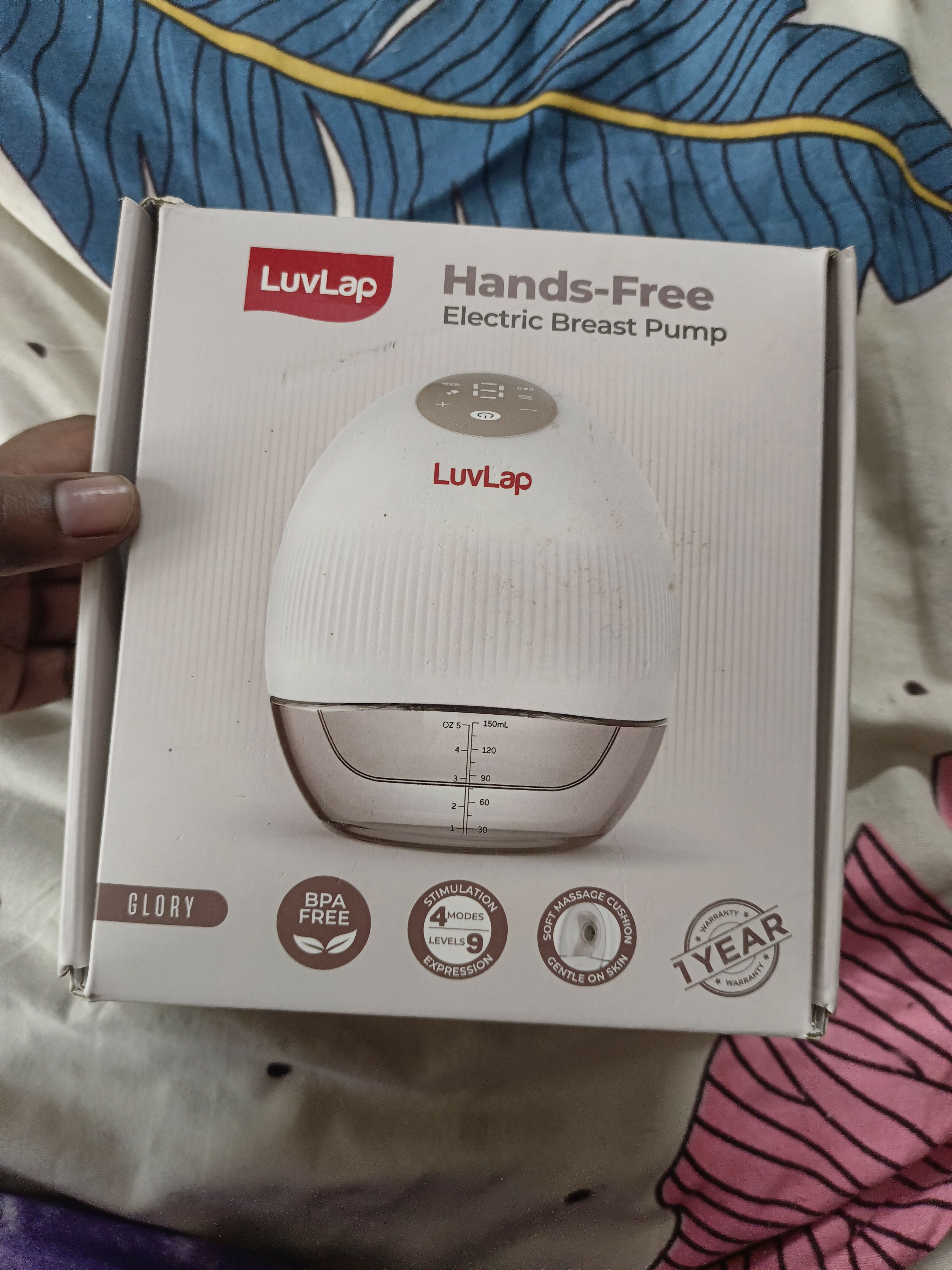 LUVLAP Handsfree/Wearable Breast Pump featuring a compact wearable design, adjustable pumping settings and comfortable fit for convenient hands-free breast milk expression at home, work or while travelling.