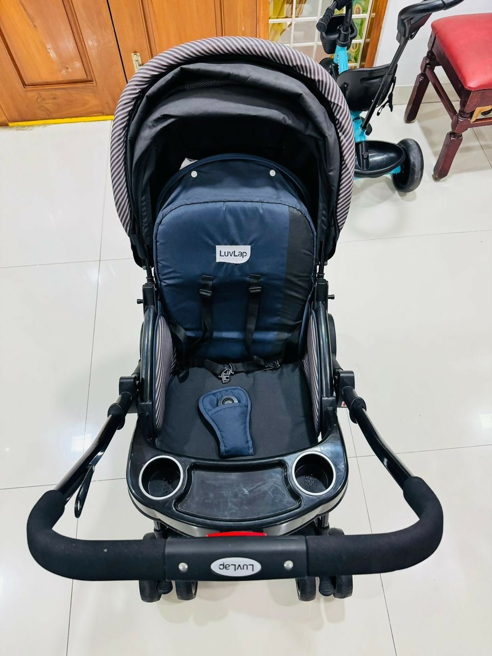 LuvLap baby stroller with lightweight foldable design, reclining seat, adjustable canopy, 5-point safety harness, smooth wheels, and storage basket for comfortable travel with babies and toddlers.