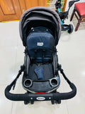 LuvLap baby stroller with lightweight foldable design, reclining seat, adjustable canopy, 5-point safety harness, smooth wheels, and storage basket for comfortable travel with babies and toddlers.