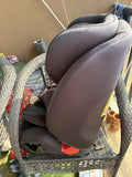 Child's car seat on a chair outdoors