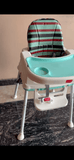 LuvLap 4 in 1 high chair with multi-functional design, adjustable seating, feeding tray, secure safety harness, and comfortable support for babies and toddlers during mealtimes.
