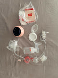 LuvLap Adore electric breast pump with adjustable suction, compact design, milk collection bottle, and comfortable pumping support for breastfeeding mothers.