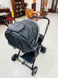 LuvLap baby stroller with lightweight foldable design, reclining seat, adjustable canopy, 5-point safety harness, smooth wheels, and storage basket for comfortable travel with babies and toddlers.