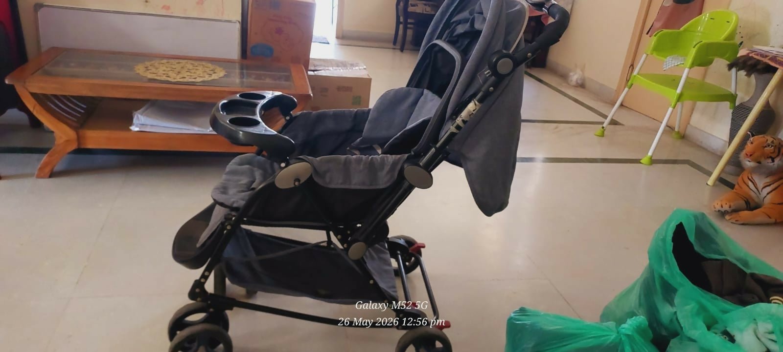 MEE MEE stroller and pram with rocker function, reclining seat, smooth wheels, safety harness, adjustable canopy, and dual stroller-to-rocker design for baby comfort and travel.