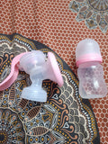 LuvLap Manual Breast Pump featuring a simple hand-operated design and comfortable breast cushion, offering a compact and convenient option for occasional pumping at home or while travelling