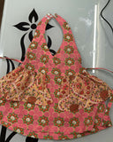 Floral apron with matching pouch on a white background