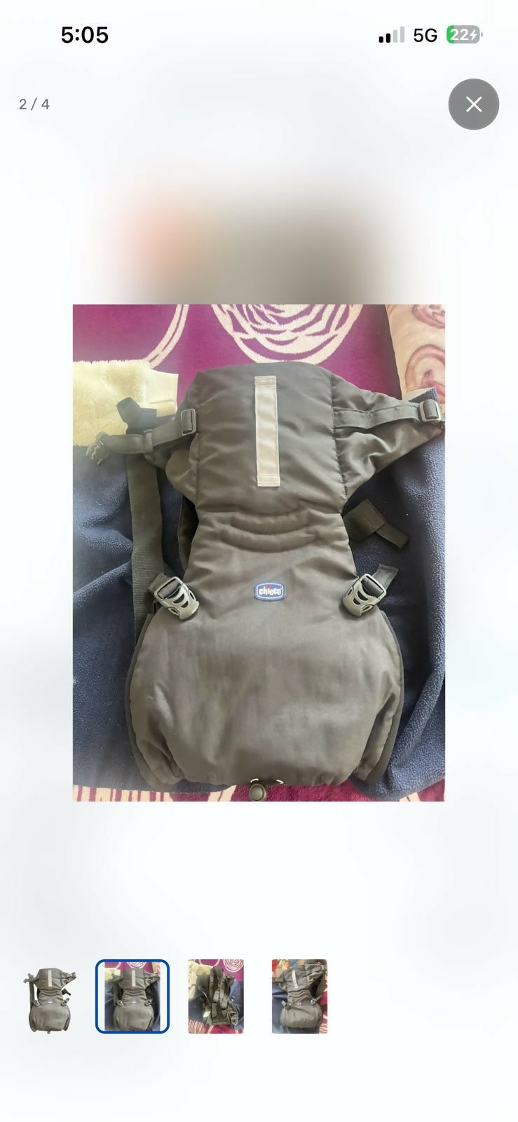 Chicco baby carrier with ergonomic design, padded shoulder straps, adjustable waist support, secure buckles, and multiple carrying positions for comfortable babywearing.
