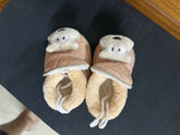 Pair of baby shoes with bear face design