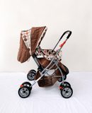 BABYHUG Cosy Cosmo baby stroller with reclining seat, foldable pram design, safety harness, smooth wheels, adjustable canopy, and comfortable travel support from newborn to tod