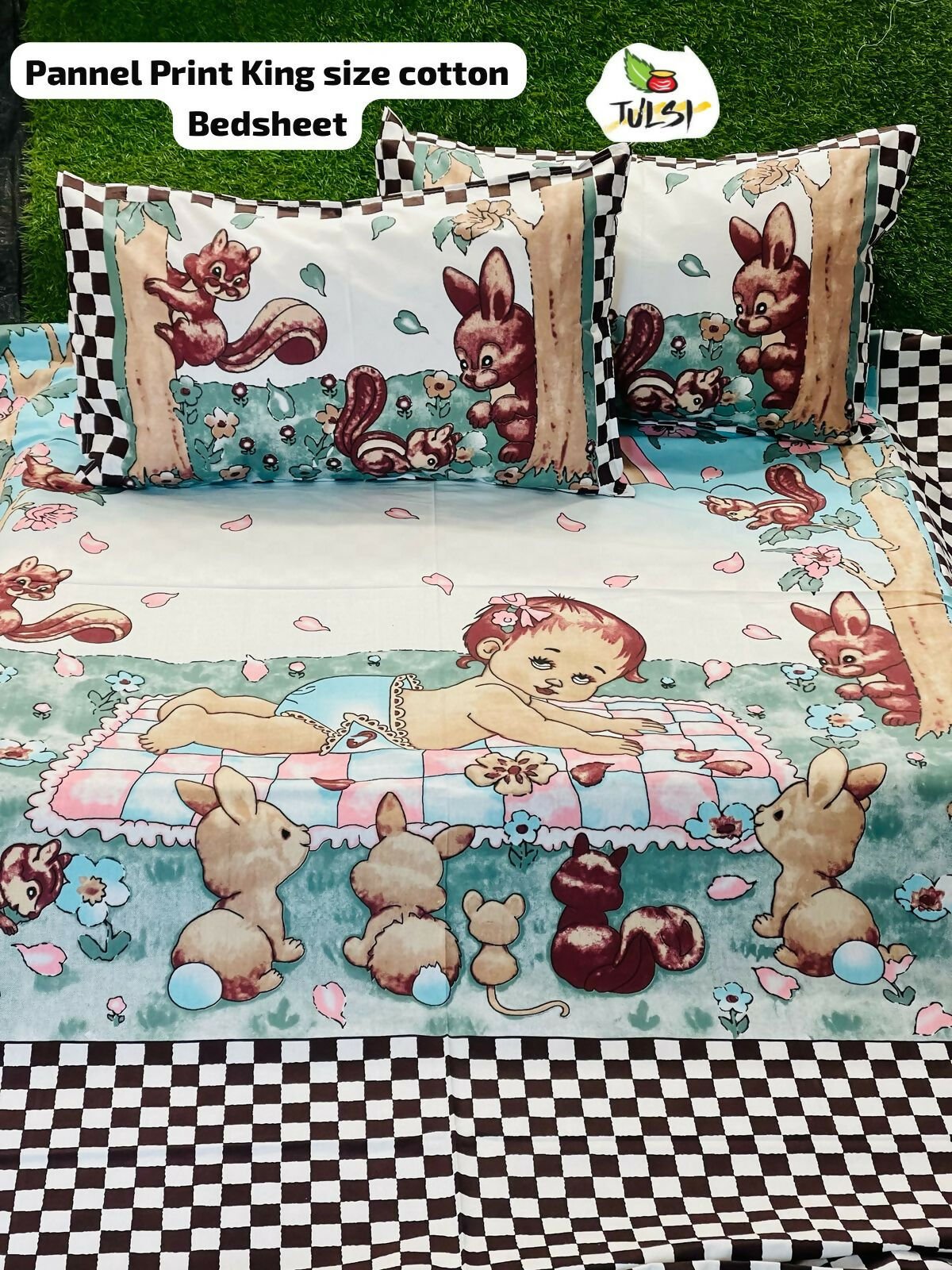 Children's cartoon-themed bedsheet with animals and a baby on a checkered background
