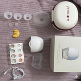 PROMOM wearable hands-free electric breast pump with compact design for comfortable milk expression, portable and convenient for breastfeeding moms.