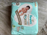 Pampers Baby Diaper Combo with 2 packs of 70 diapers each, featuring soft breathable materials, high absorbency, leak protection, stretchy waistband, and a comfortable fit for babies.
