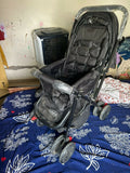 BABYHUG Cocoon stroller with mosquito net, reclining seat, safety harness, protective canopy, smooth wheels, and comfortable travel design for babies.