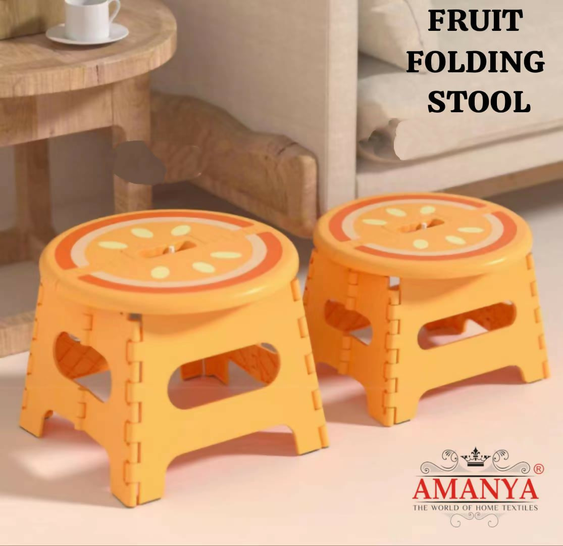 Two orange folding stools with fruit design