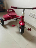 RADIO FLYER tricycle with sturdy construction, comfortable seat, easy-grip handlebars, smooth wheels, and child-friendly design for outdoor play and riding adventures.