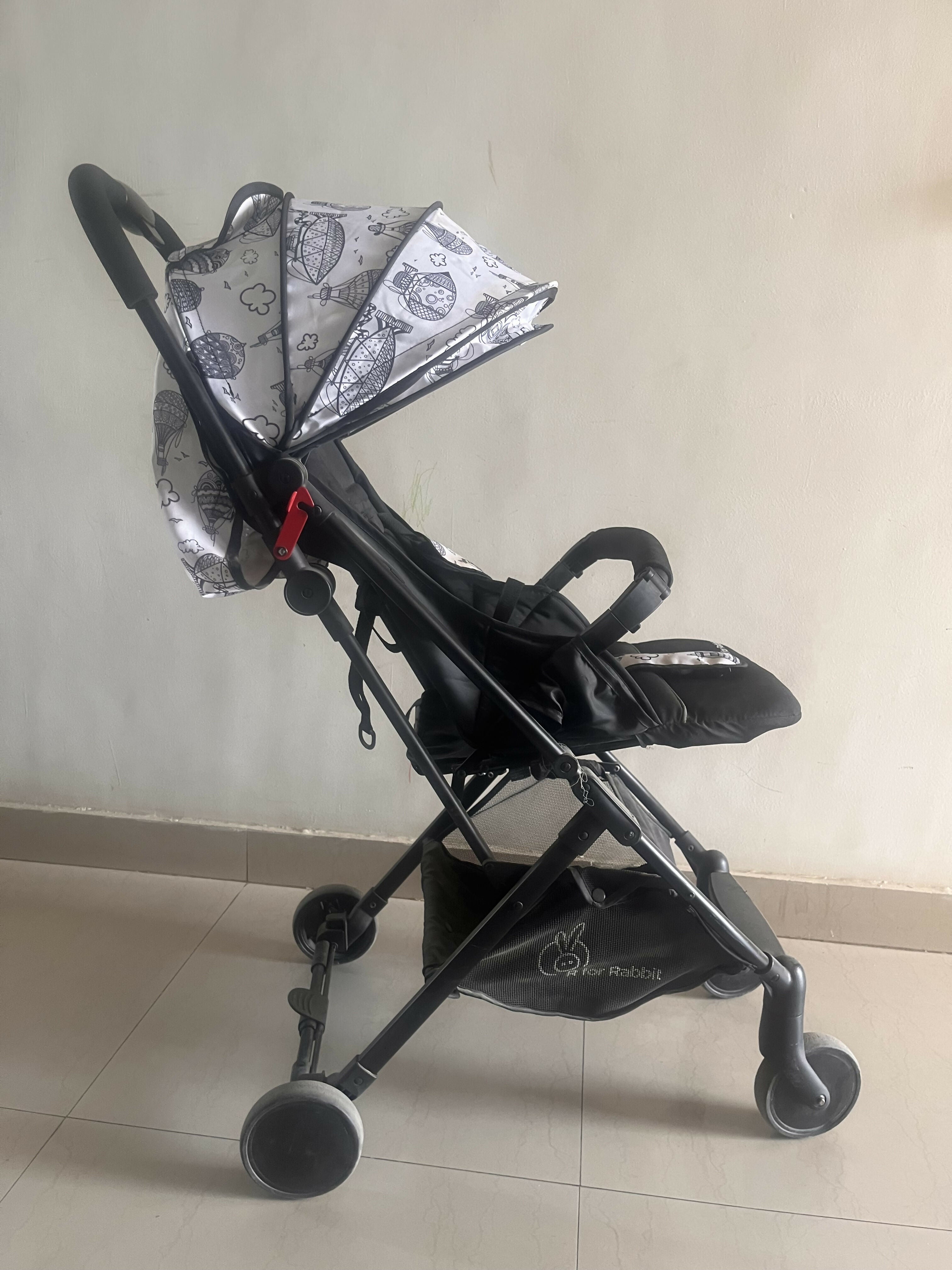 R for Rabbit Pocket Lite stroller with lightweight foldable design, reclining seat, smooth wheels, safety harness, and compact travel-friendly comfort for babies and toddlers.