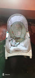 R for Rabbit rocker/bouncer with a cushioned seat, gentle bouncing and rocking motion, secure safety harness, and sturdy frame for soothing, relaxing, and entertaining newborns and infants.