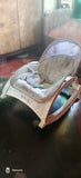 R for Rabbit rocker/bouncer with a cushioned seat, gentle bouncing and rocking motion, secure safety harness, and sturdy frame for soothing, relaxing, and entertaining newborns and infants.