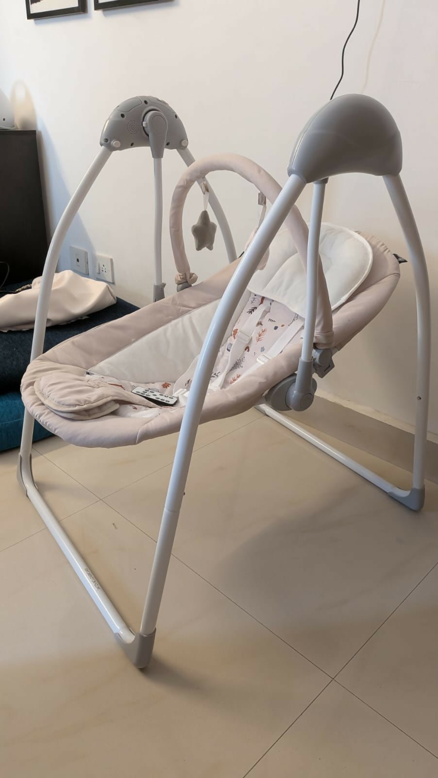R for Rabbit automatic electric swing with gentle rocking motion, cushioned seat, secure safety harness, soothing comfort, and relaxing support for babies.