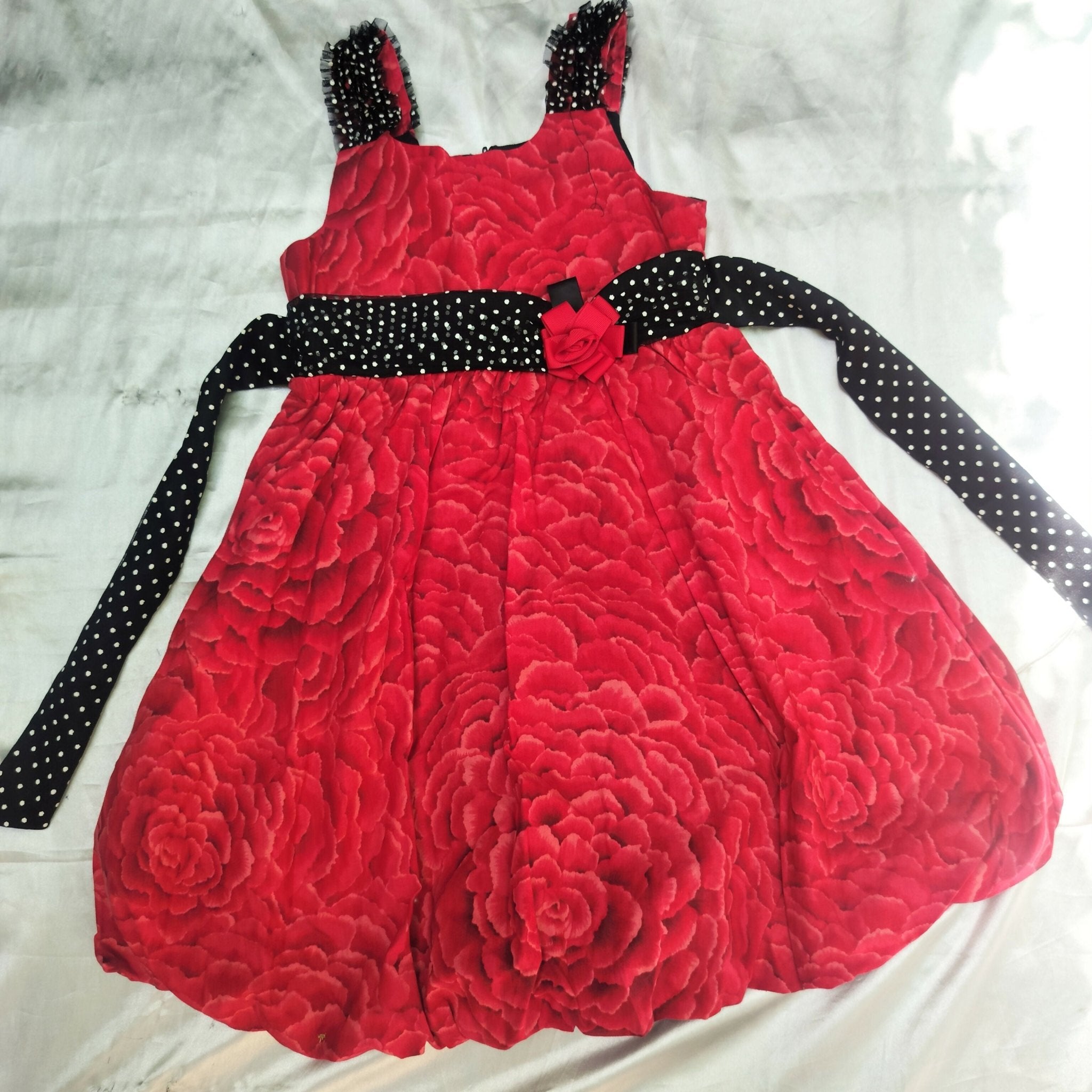 Red cute dress for girls with soft fabric, comfortable fit, stylish design, and charming look for casual wear, parties, or special occasions.