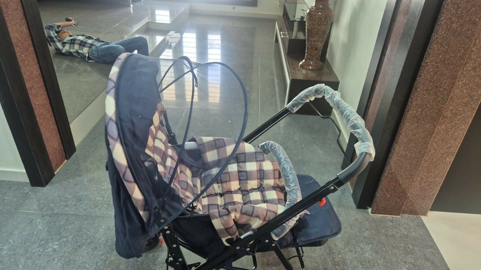 STAR AND DAISY Sunrise Baby Stroller with adjustable canopy, padded seat, and sturdy wheels in a modern design.